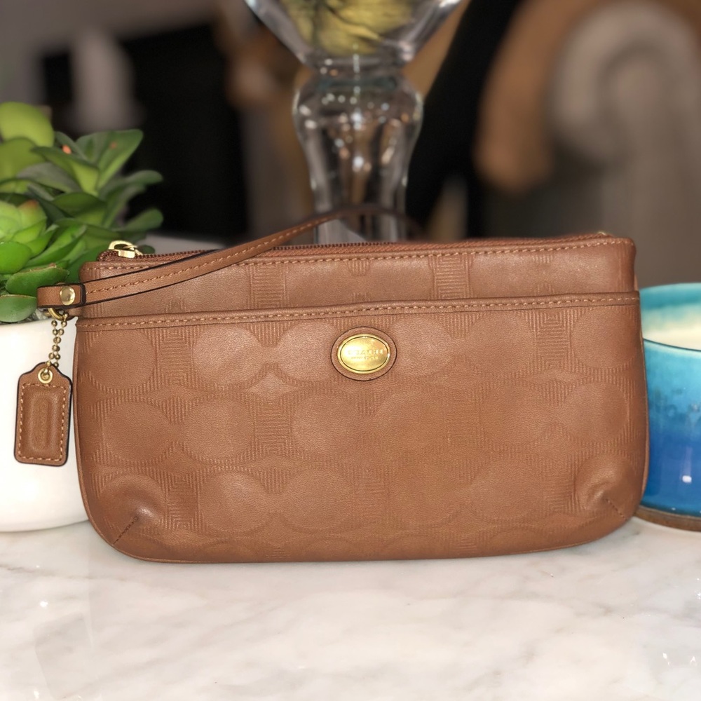 Coach tan leather embossed signature wristlet. 😎